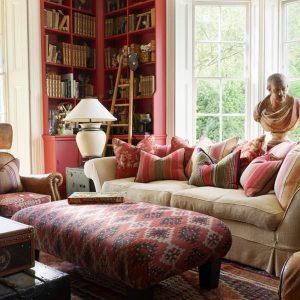 141351-constantine-stool-in-orillo-brick-egerton-sofa-with-cabin-cushions-library-landscape-lifestyle-sml