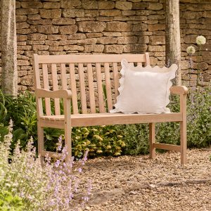 repton_wooden_natural_two_seater_bench_dressed_for_a_cosy_day_reading